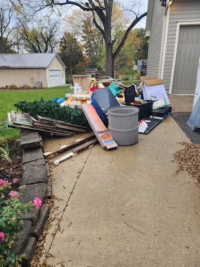 Dumpster being loaded with debris for 30 Yard Dumpster Rental in Prairie du Sac
